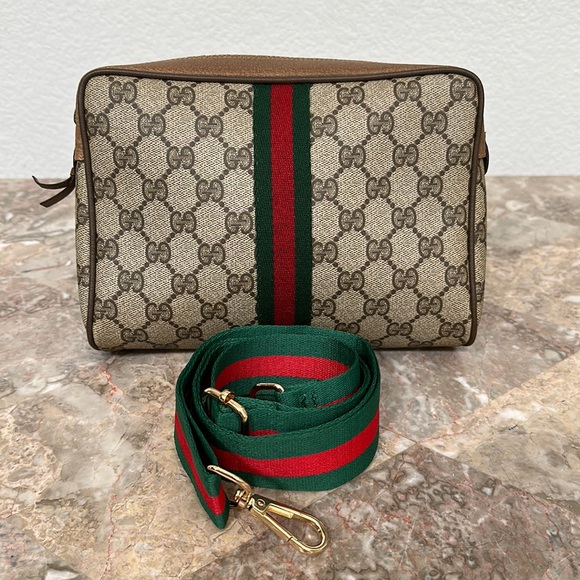 Gucci Handbags - Gucci PVC vintage pouch w fashion chain